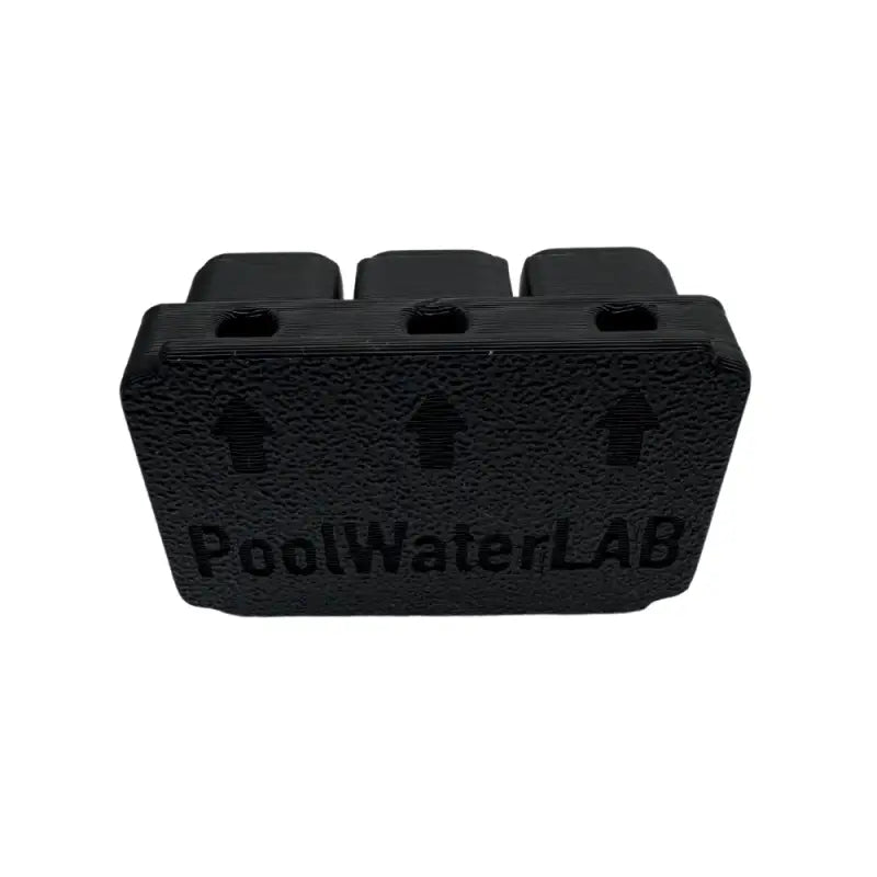 Black, rectangular, three-holed, plastic block.